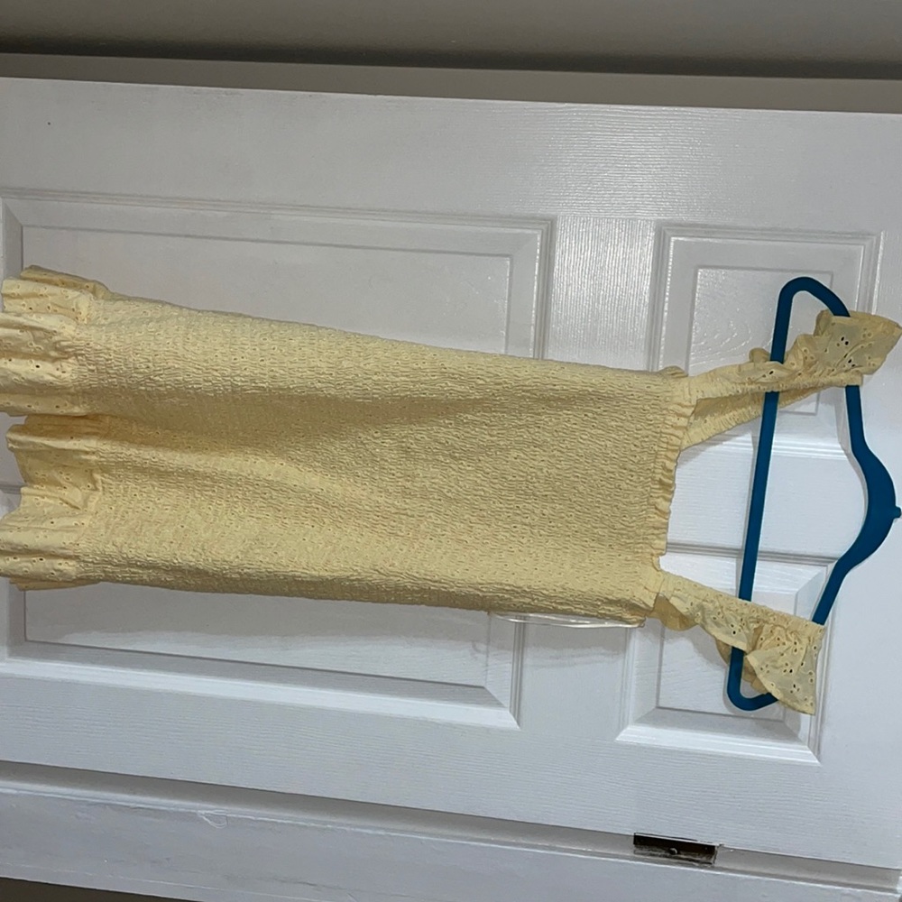 Small lost/wander dress worn once!Yellow tight with frills on shoulder-stretchy